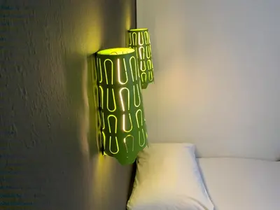 a green lamp on a wall next to a bed at Hotel Oorsprongpark City Centre Utrecht in Utrecht