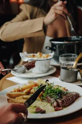 a table with plates of food on a table at The Diamond Amsterdam in Amsterdam