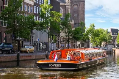 an orange boat on a river in a city at House on estate near Amsterdam and Keukenhof in Lisserbroek