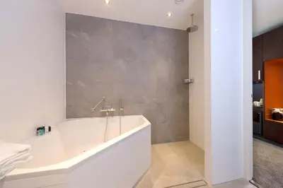 a bathroom with a large tub in a room at Van der Valk Hotel Hilversum/ De Witte Bergen in Hilversum