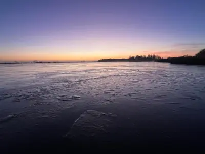 a view of a body of water at sunset at Over Lake in Monnickendam