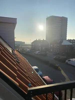 a view of a parking lot with cars parked at LONG BEACH ROOMS 3 in Zandvoort