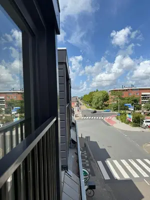 a balcony with a view of a city street at Eetcafé Punt in Roelofarendsveen