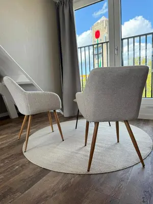 a pair of chairs in a room with a balcony at Eetcafé Punt in Roelofarendsveen