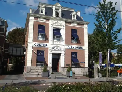 an old brick building with a coffee shop at Hotel Fine Harmony in Amsterdam