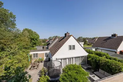 an aerial view of a white house at Het Warme nest in Noordwijkerhout