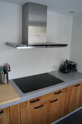 a kitchen with a stove and a counter top at Het Warme nest in Noordwijkerhout
