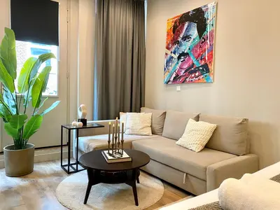 a living room with a couch and a table at Amsterdam Grachtenappartement in Amsterdam