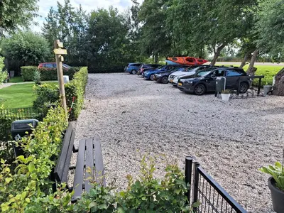 a row of cars parked in a parking lot at Park De Driesprong in Nieuwveen