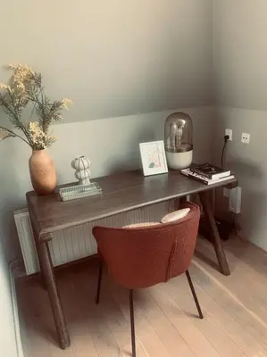 a wooden desk with a chair in a room at Have a nice stay! - Main Street beachapartment, beach 150 meters in Noordwijk aan Zee