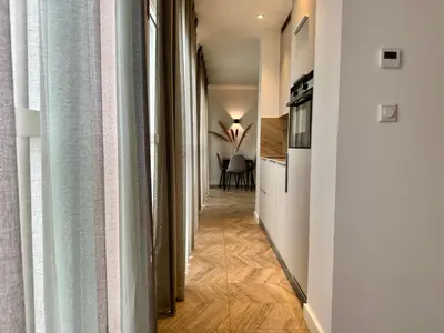 a hallway leading to a living room with a kitchen at Homes by the C in Zandvoort