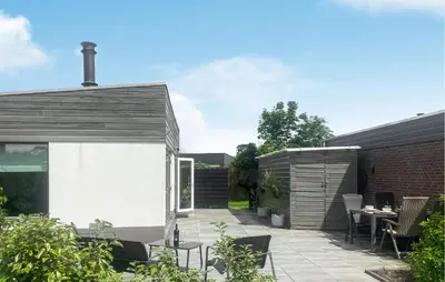 an outdoor patio with a table and chairs at 2 Bedroom Cozy Home In Noordwijkerhout in Noordwijkerhout
