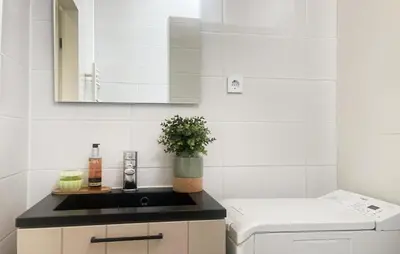 a white kitchen with a sink and a counter at 2 Bedroom Cozy Home In Noordwijkerhout in Noordwijkerhout