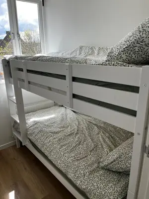 a white bunk bed in a room with a window at Apartement hotel Stays by ADM in Leiden