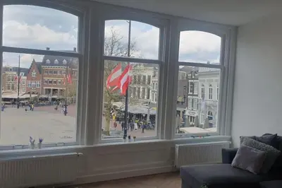 a large window with a view of a city street at Apartement City Center Gouda: View Deluxe in Gouda