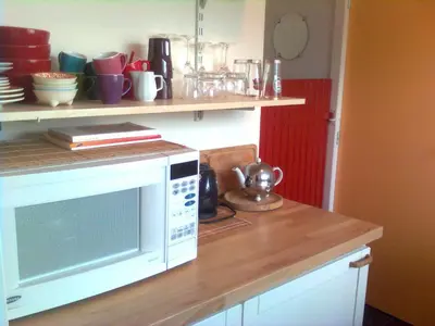 a kitchen with a white microwave on a counter at Studio 99 in Amsterdam
