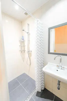 a bathroom with a shower and a sink at Hello Stay Utrecht in Utrecht