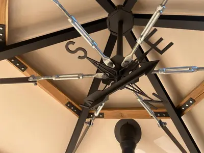 a chandelier hanging from the ceiling of a room at Ons Huisje Achter - De Hooischuur in Noordwijkerhout
