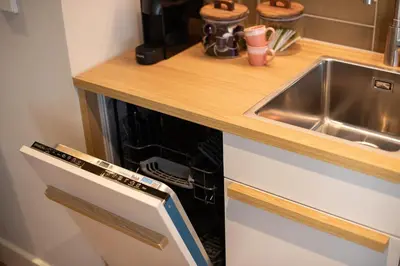 a kitchen with a sink and a counter top at Storehouse Studios in Amsterdam