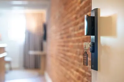 a door with a key in a brick wall at Storehouse Studios in Amsterdam
