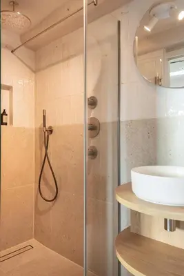 a bathroom with a shower and a sink at Storehouse Studios in Amsterdam