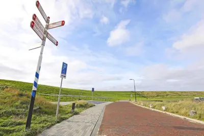 a street sign on the side of a road at Appartement Zandkorrel in Schoorl
