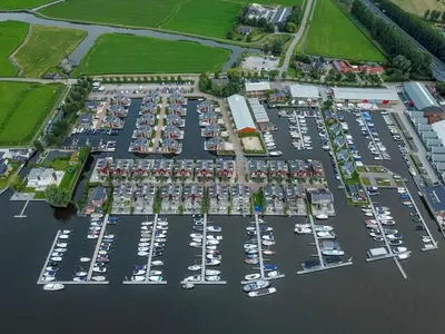 an aerial view of a harbor filled with boats at Dorregeest in Uitgeest