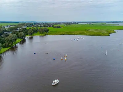 an aerial view of a river with boats in it at Dorregeest in Uitgeest