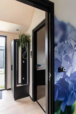 an open door in a room with blue flowers at GreenFloat Boskoop #2 in Boskoop