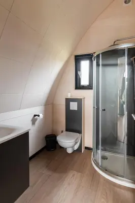 a bathroom with a toilet and a shower at GreenFloat Boskoop #2 in Boskoop