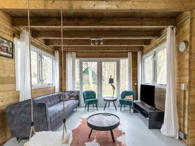 a living room with a couch and a table at Scilla in Soesterberg