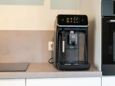 a coffee maker sitting on a counter next to a microwave at Scilla in Soesterberg