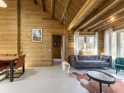 a living room with a couch and a table at Scilla in Soesterberg