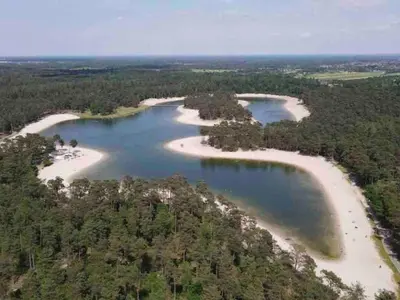 an aerial view of a group of islands in water at Scilla in Soesterberg