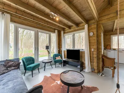 a living room with a couch and chairs at Scilla in Soesterberg