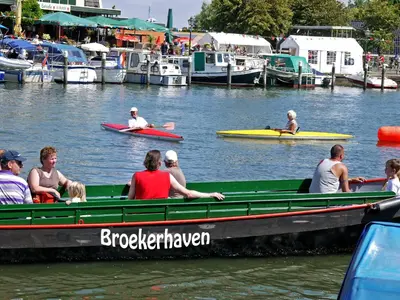 a group of people on a boat in the water at Markermeerlogies in Bovenkarspel