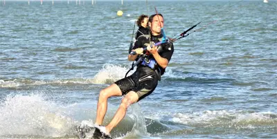 a man and woman water skiing in the ocean at Markermeerlogies in Bovenkarspel