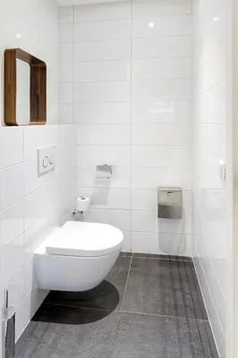 a white bathroom with a toilet and a mirror at Marnix360apartments The Mansion Suites in Amsterdam