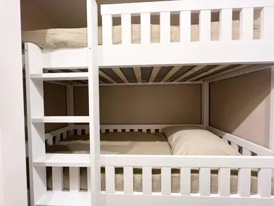 a white bunk bed in a room at New- The Cabana- With Sauna and Hot Tub, on a lake near Amsterdam in Vinkeveen