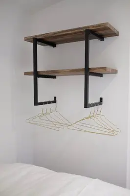 a pair of shelves hanging on a wall at Beach Lodge 24 - Noordwijk aan Zee - met eigen tuin in Noordwijk