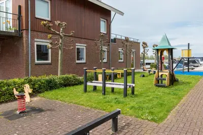 a park with a playground with a play equipment at Meerzicht 59 - Ideal family appt for 6 persons in Uitgeest