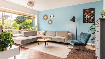 a living room with a couch and a table at Casa Mimi in Bergen