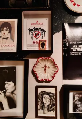 a group of pictures and framed photos on a table at WS77 B&B Apartment in Leiden