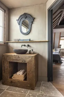 a bathroom with a sink and a mirror at Bed and Breakfast Lokaal Wadway in Spanbroek