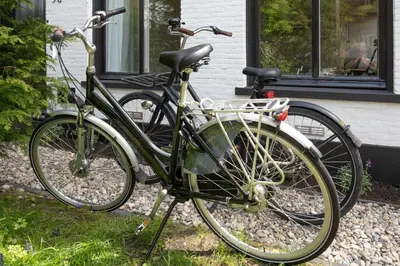 a bike parked in front of a house at Cosy Dutch Delight Apartment in Santpoort-Zuid
