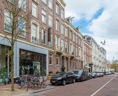 a city street with buildings and bikes parked on the street at Hotel Cornelisz in Amsterdam