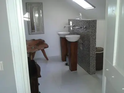 a bathroom with a sink and a mirror at Riante Boerderij in Het Groene Hart Regio Utrecht in Oudewater
