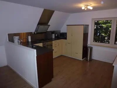a kitchen with a sink and a counter top at Schiphol Apartments in Aalsmeer