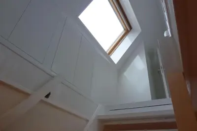 a skylight in a ceiling with a window at Schiphol Apartments in Aalsmeer