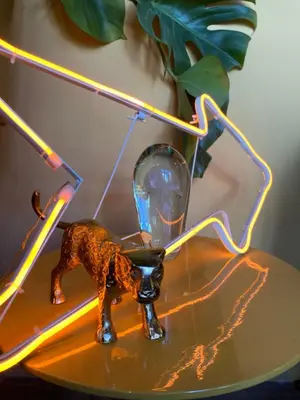 a toy dog on a table next to a mirror at Deborah's Hiding Place in Alkmaar